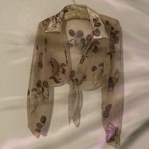 Sexy floral sheer, front tie half shirt. Silky looking collar and cuffs.